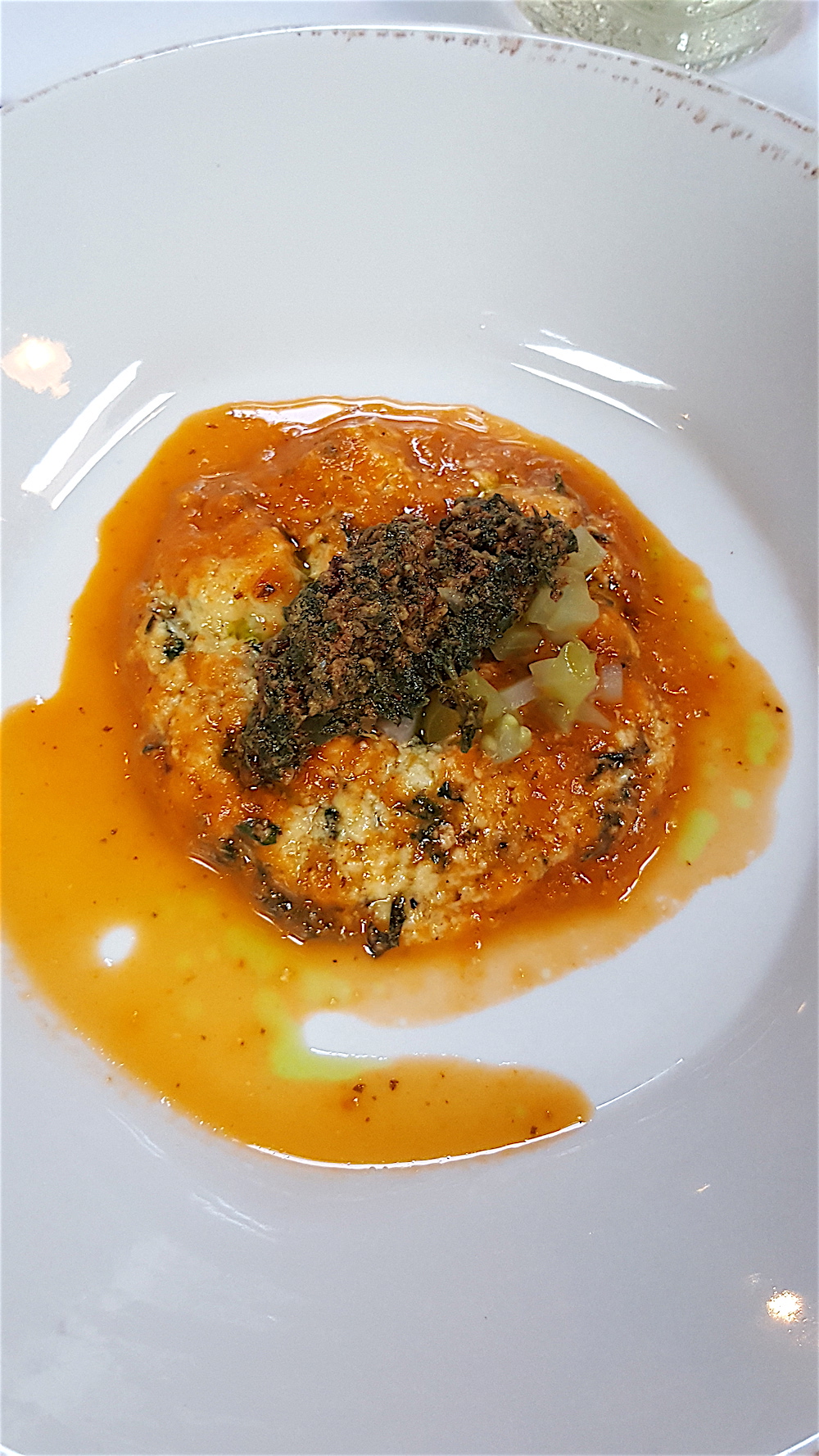 Gnudi with red tomato sauce, green tomato relish and tomato leaf pesto. Wow, it was good.