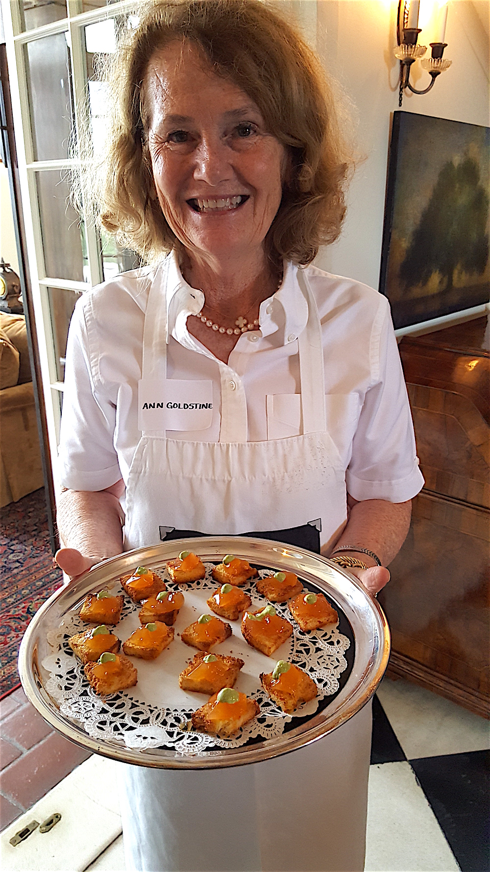 Ann Goldstine offering tomato aspic on buttery toast with basil mayonnaise. Delicious little morsels.