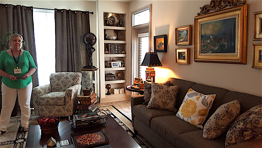 Roger's friend Rhonda Byrd in the living room. "I had intended to go minimalist in this apartment," Roger laughed. "But I just kept bringing in more and more things!"