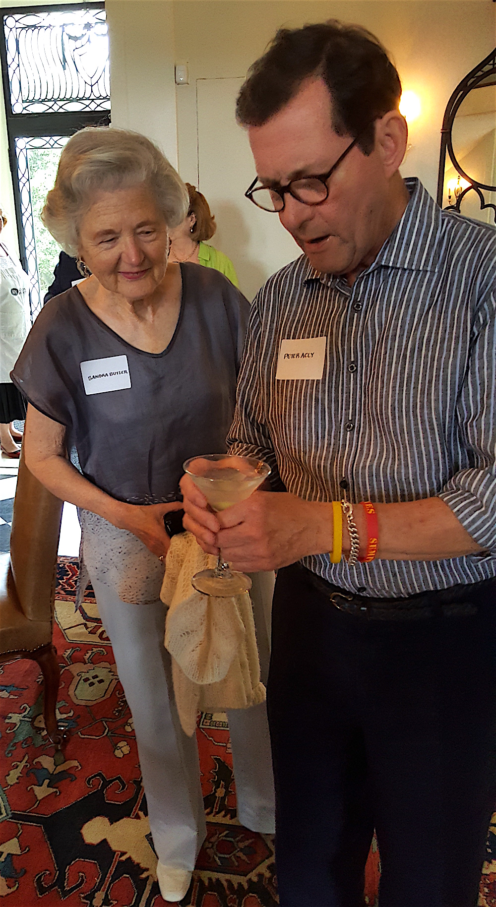 Sandra Butler and Peter Acly discussing the liquid olive.