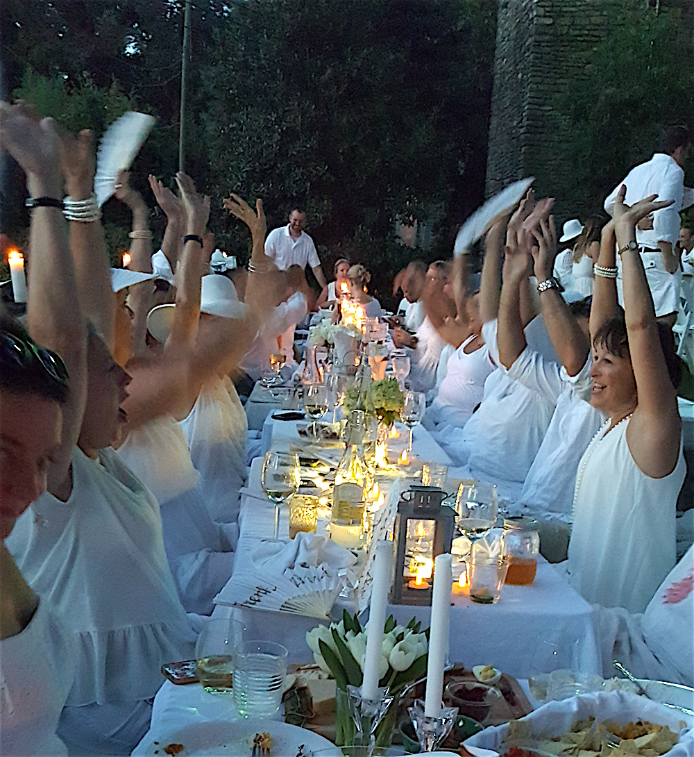 A traditional "napkin wave" started the White Picnic at Knoxville Botanical Garden last Saturday.