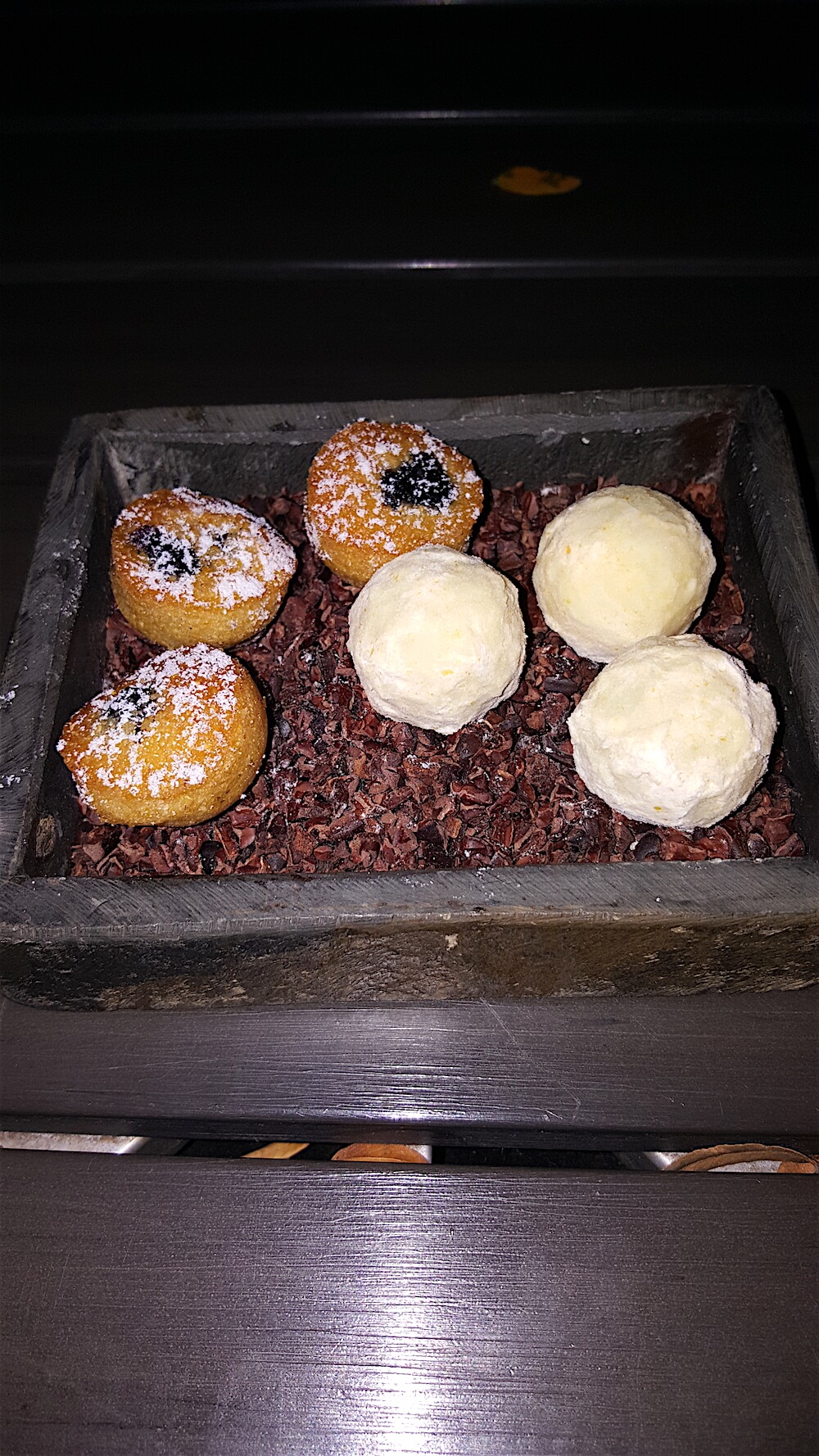 As if we needed more food, we received these little jewels as we were paying our tab. On the left, little blueberry corn cakes. On the right, delicious white chocolate truffles. Of course, we managed to eat them all.