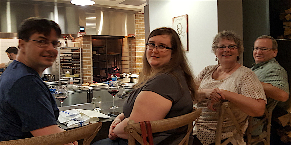 Mary Constantine, second from right, the food editor at the News Sentinel, scored the "chef's seats" overlooking the busy kitchen. With her are, from left, Trystan and Shelley Kimel and Mary's fiance, Matt Graveline.