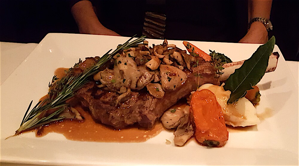 Lane selected a roasted veal loin chop with oyster mushrooms sauce. She did not leave hungry!
