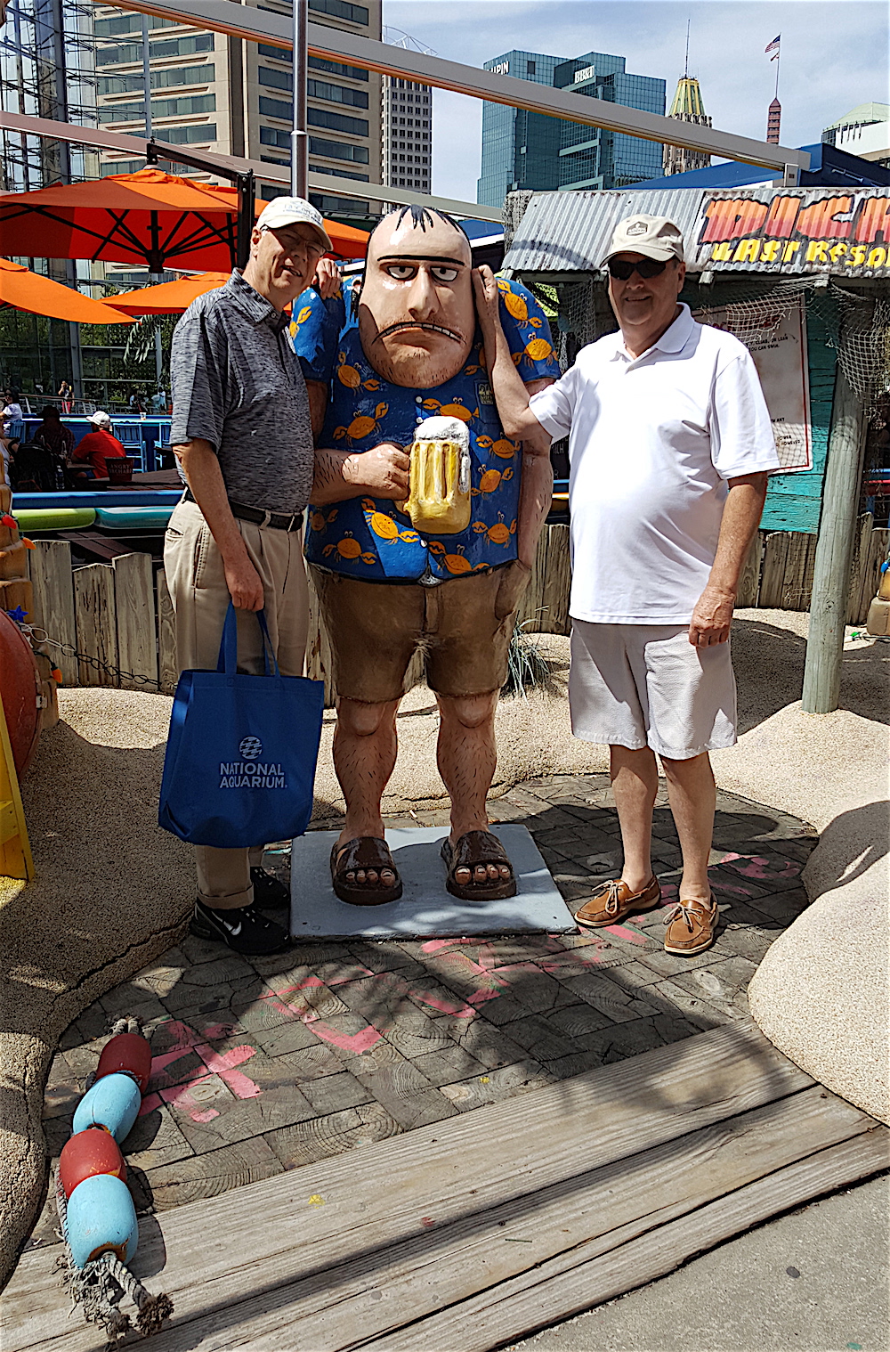 Three tourists. That middle one is the mascot for a comedy club called Dick's Last Resort.