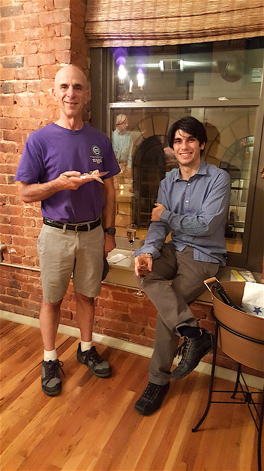 Downtown dweller Bill Lyons, left, with new Knoxville Symphony music director Aram Demirjian at the final stop of our progressive dinner Saturday.
