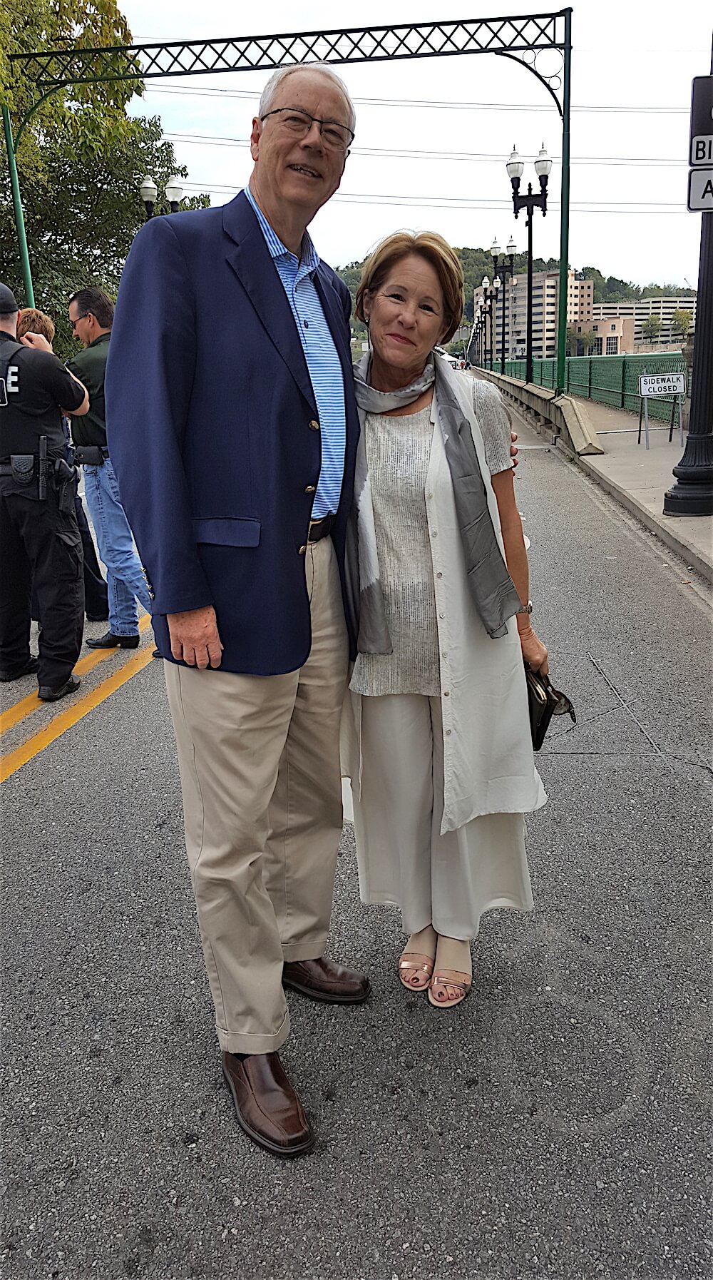 Judith Foltz, the city's director of special events, greets Alan Carmichael.
