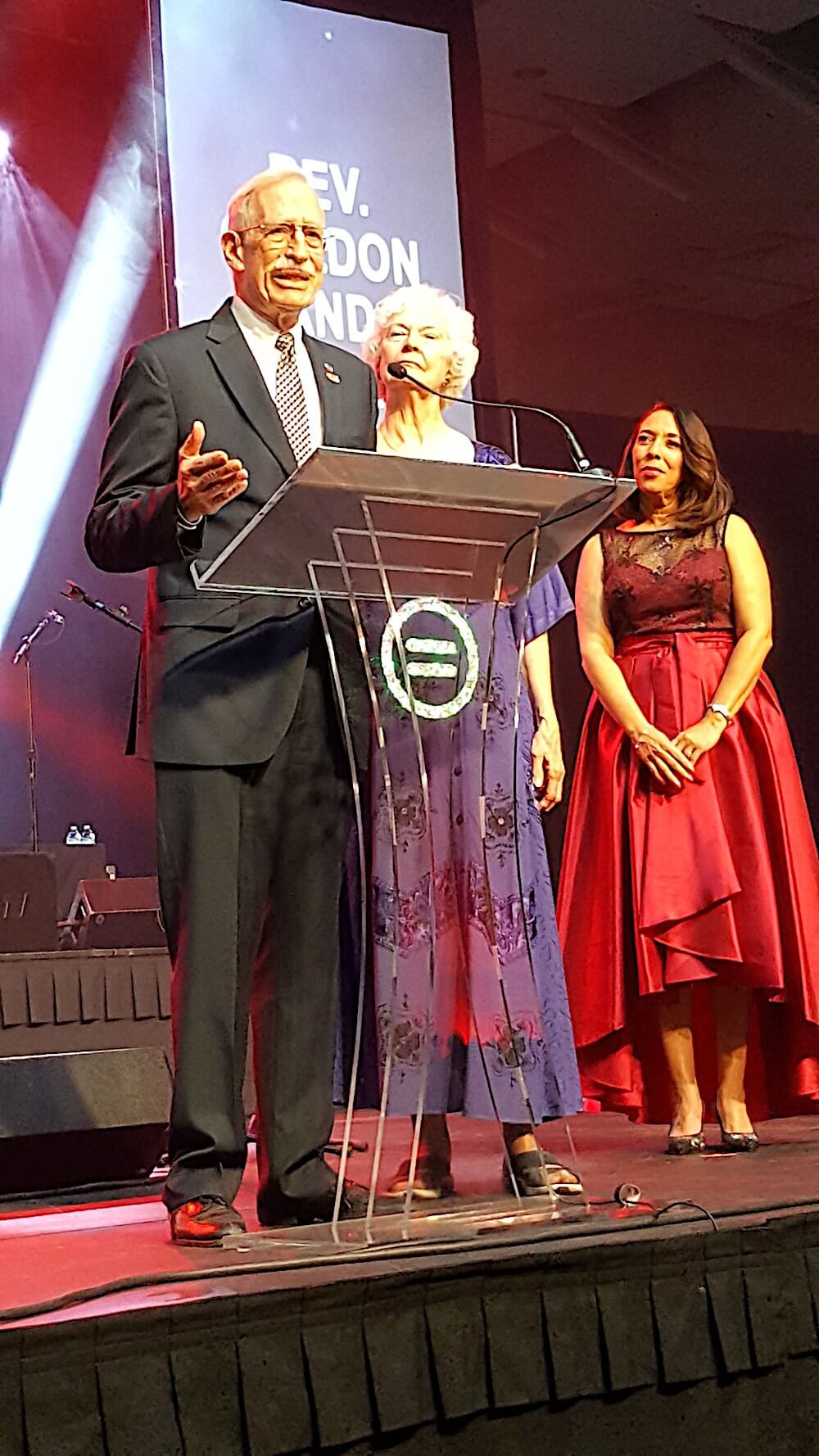 Gordon and Judy Gibson accept their lifetime achievement award as Gwen McKenzie looks on.