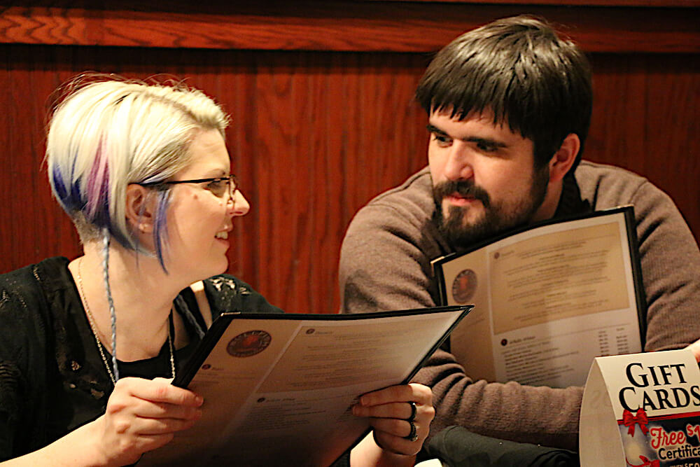 Then we had to figure out what to order for our main courses. Jessica and Greg discussing menu options. (Photo by Pam Rhoades)