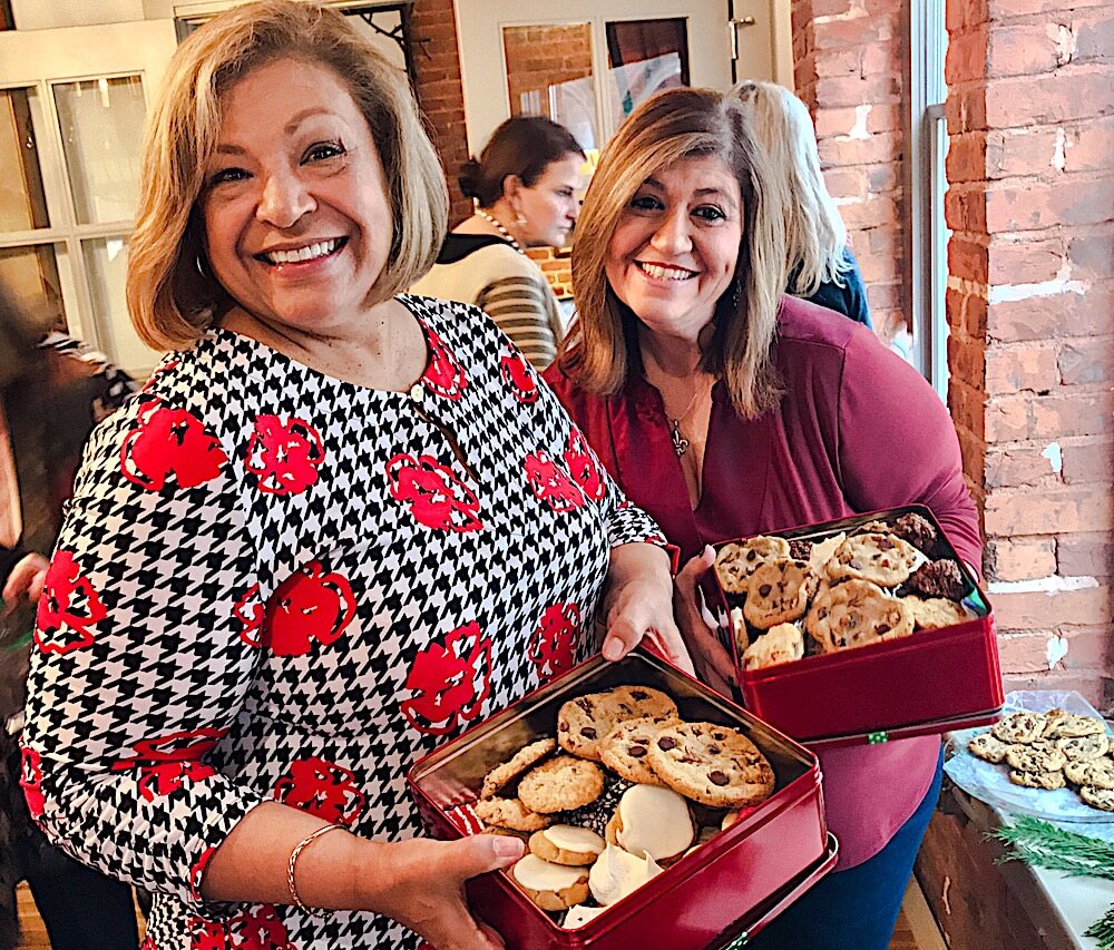 Phyllis Nichols, left, and Shaun Fulco seem happy with their haul of cookies. (Photo by Pam Rhoades)