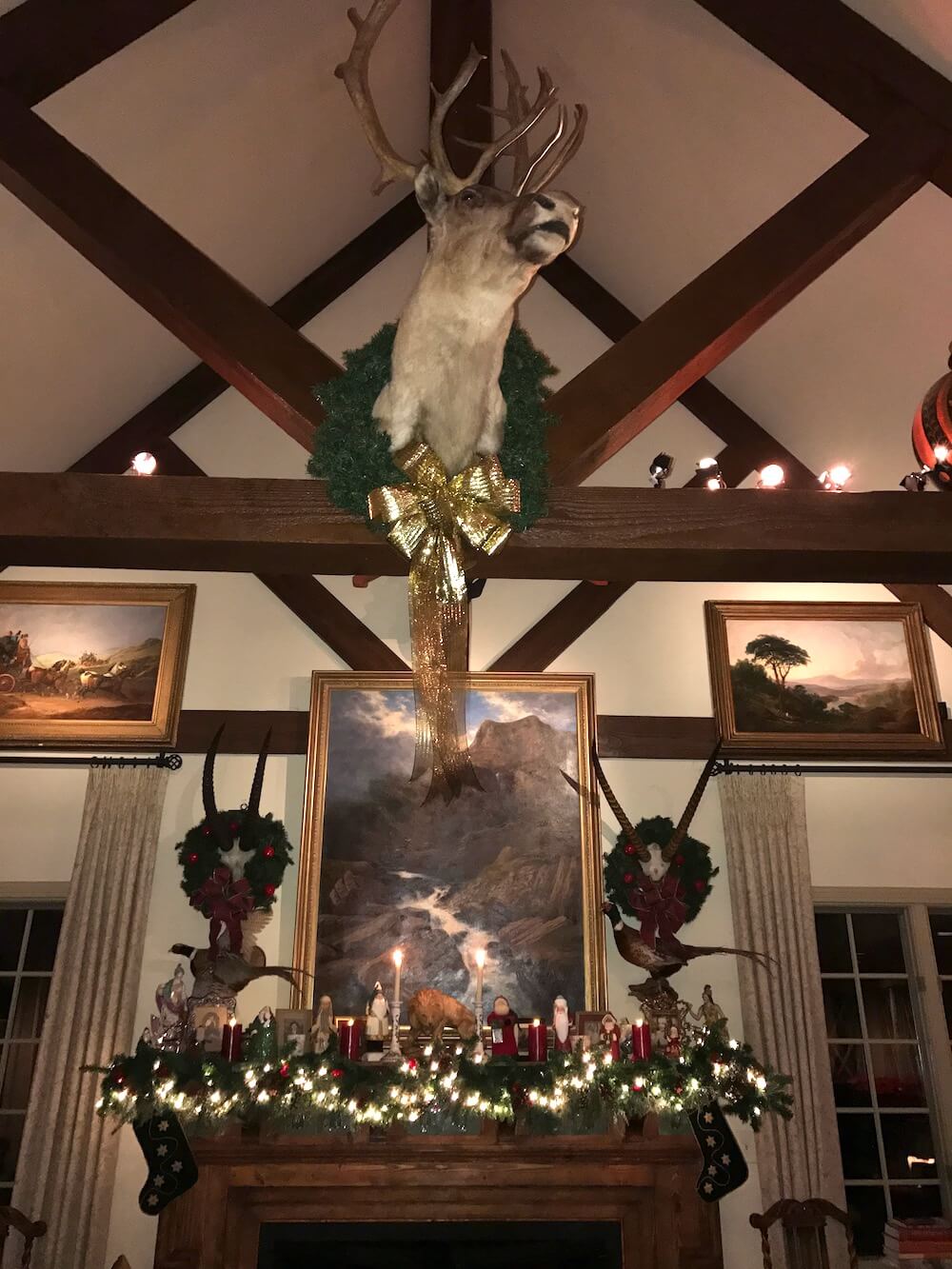 The living room, still decorated for Christmas, had the feeling of an English lodge.