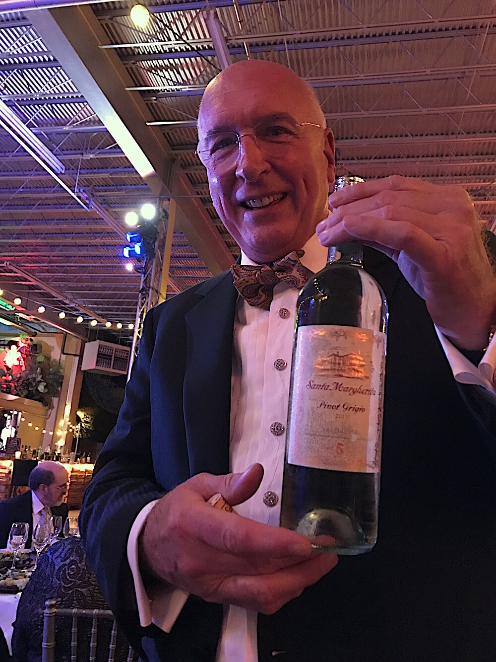 Best pic of the night! Richard bringing a bottle of pinot grigio to our table!