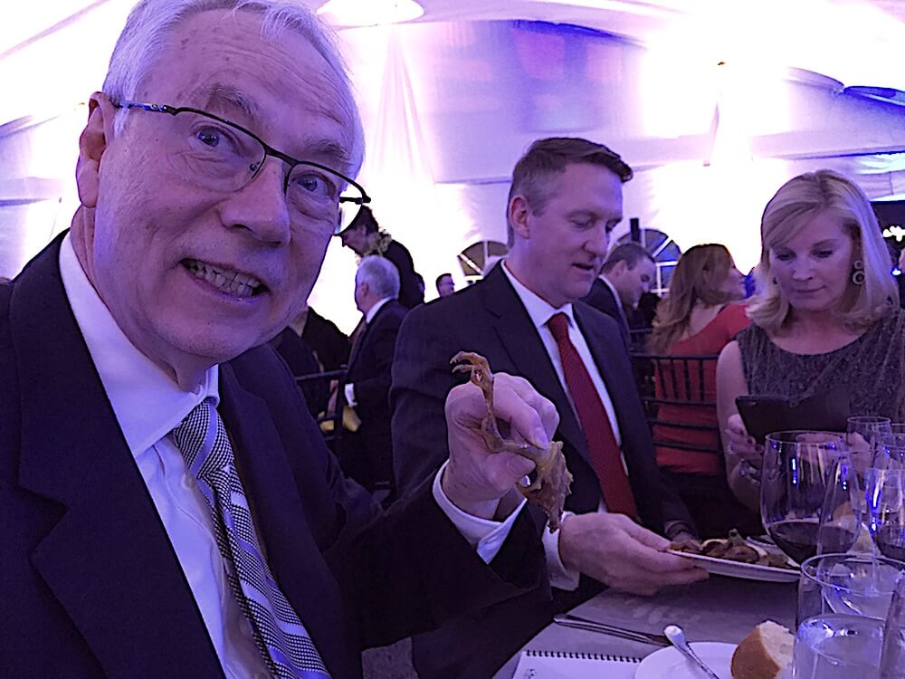 My normally sweet husband teasing me with the squab claw.