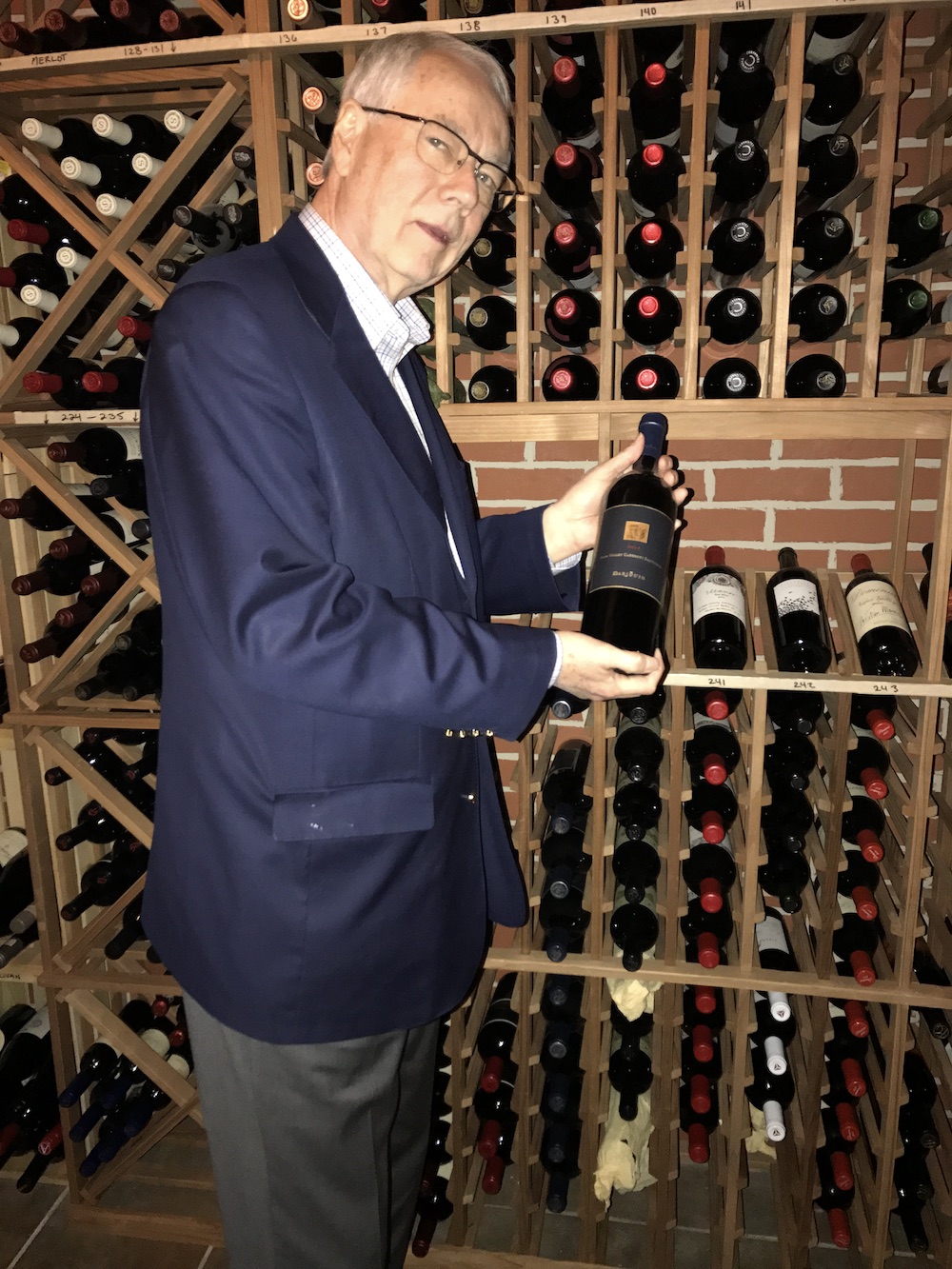 We wandered around between courses studying the goods. Here's my husband, Alan Carmichael. (Honey, I don't think we were supposed to touch those!)