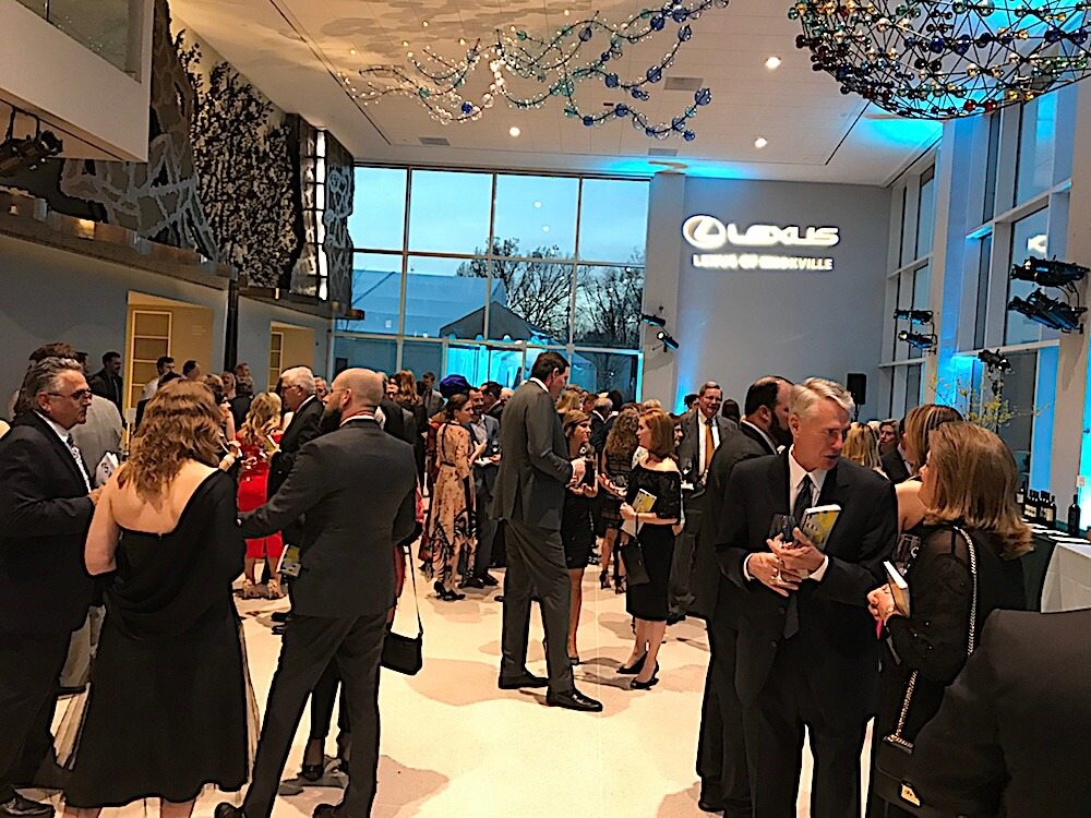 Everyone crowded into the Steve and Ann Bailey Great Hall for hors d'oeuvres and a silent auction. Three bars also provided wine samples from local distributors.