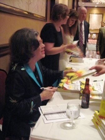 Rheta Grimsley Johnson signs her new book during a Knoxville visit