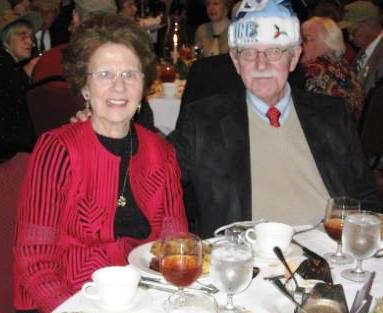 Patsy and Charlie Daniel wearing a Universtiy of North Carolina Santa hat