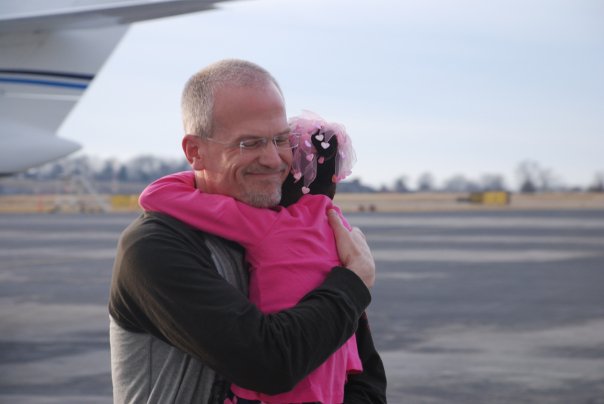 pilot-employee Pilot employee Al Fitzgerald leaves the plane with his daughter, Jayla