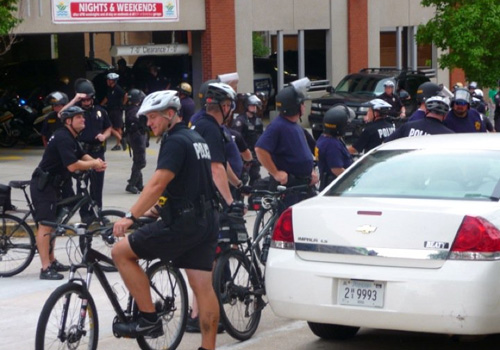 bike-cops Bicycle cops clustered outside the Market Square Garage prior to the 3 p.m. start of the National Socialists Movement march.