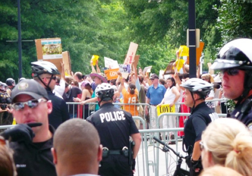 counter-protest The crowd of counter protesters was much larger than the group of marchers. The counter protesters waited on Main Street.