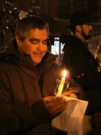 Art Carmichael, downtown resident and enthusiast, keeps his candle burning in the rain.