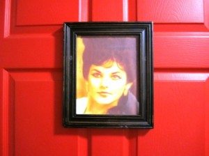 ladies-room The ladies' room is denoted by a photo of Priscilla on the door.
