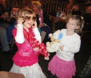 presley-and-elvis-glasses Presley tries on a pair of "Elvis glasses" complete with sideburns as her cousin Perry Crawford looks on.