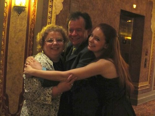 kirk-chloe-and-friend Kirk Trevor and his daughter Chloe, right, embrace Laura Dotson-Petras, who worked at the KSO when Trevor was music director here.