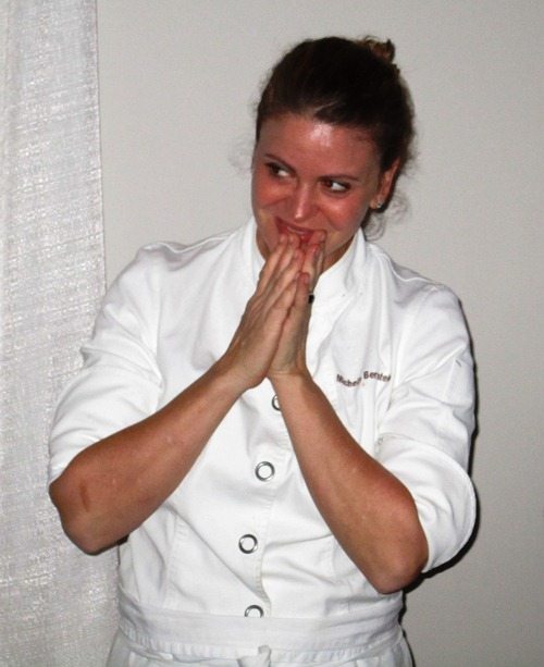 celebrity-chef Chef Michelle Bernstein comes out to a round of applause.