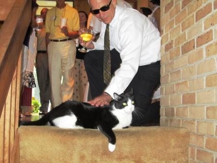 bill-petting-mikey Mikey the cat gets a pet from Bill Lyons.