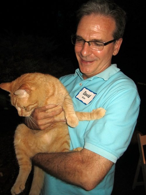 david-holds-tigger David Butler holds his outside cat, Tigger.