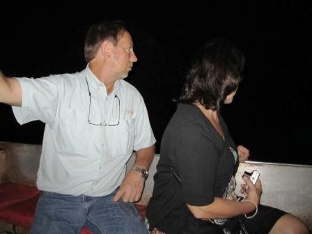 jimmy-and-tess-on-boat My brother, Jimmy Moxley, and sister-in-law, Tess Richard, in the boat. They are looking at rainbow trout that have been stocked in the lake. The trout are nearly blind and have lost 75 percent of their color due to the darkness.