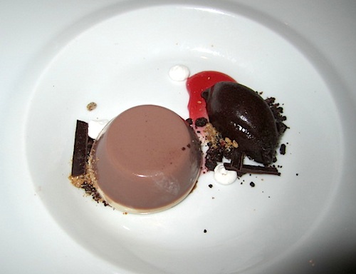 chocolate Cruze Farm chocolate milk panna cotta with dark chocolate sorbet and maraschino cherry.