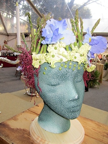 spring Holly Hambright decorated four heads with flora to honor the four seasons. This is spring.