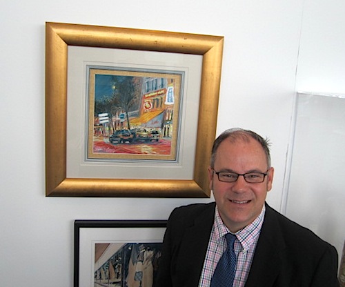 mike-berry A Knoxville auction would not be complete without a Mike Berry piece. Here is the artist at the preview luncheon standing beside his pastel called "Brasserie Lipp," a scene from Paris.