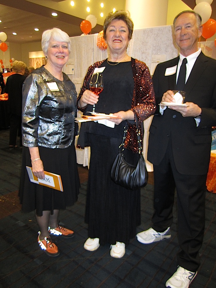 Alpha Patrick, left, with Linda and Bob DeLozier. Note the shoes!
