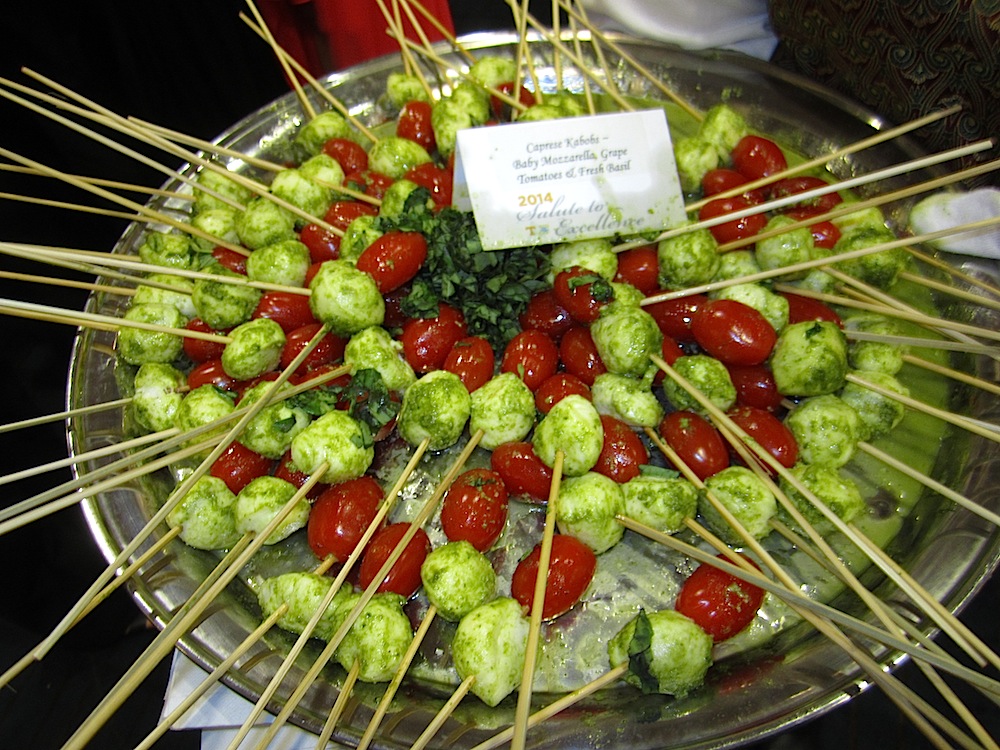 I thought it was strange that Brussels sprouts were being passed as an hors d'oeuvre. I realized they were actually baby mozzarella balls, with grape tomatoes and fresh basil!