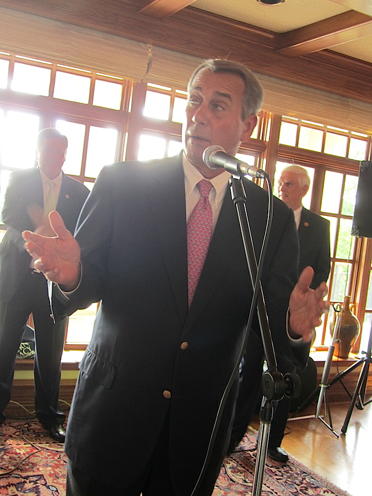 U.S. House Speaker John Boehner making remarks on Saturday in Powell. Behind him are fundraiser host Pete DeBusk, left, and Congressman Jimmy Duncan.