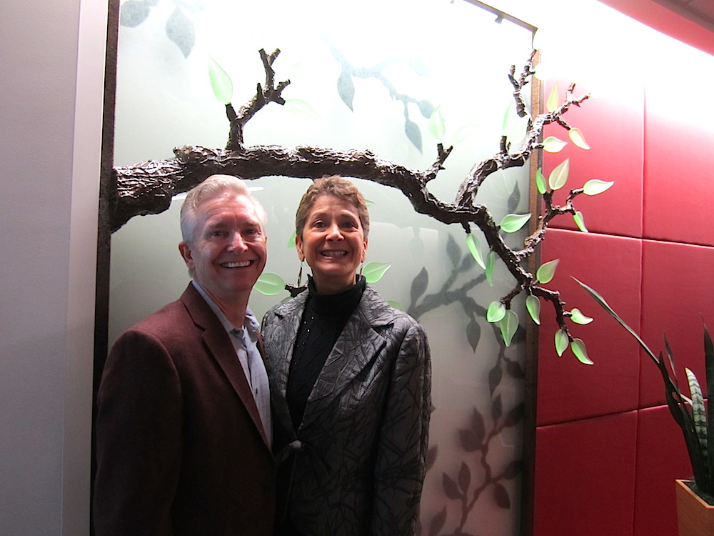 Scripps owns some beautiful glass art work by Tommie Rush of Knoxville. This tree was my favorite. Gary McCormick, of Scripps, posed in front of it with his wife, Xxxxx Xxxxx.