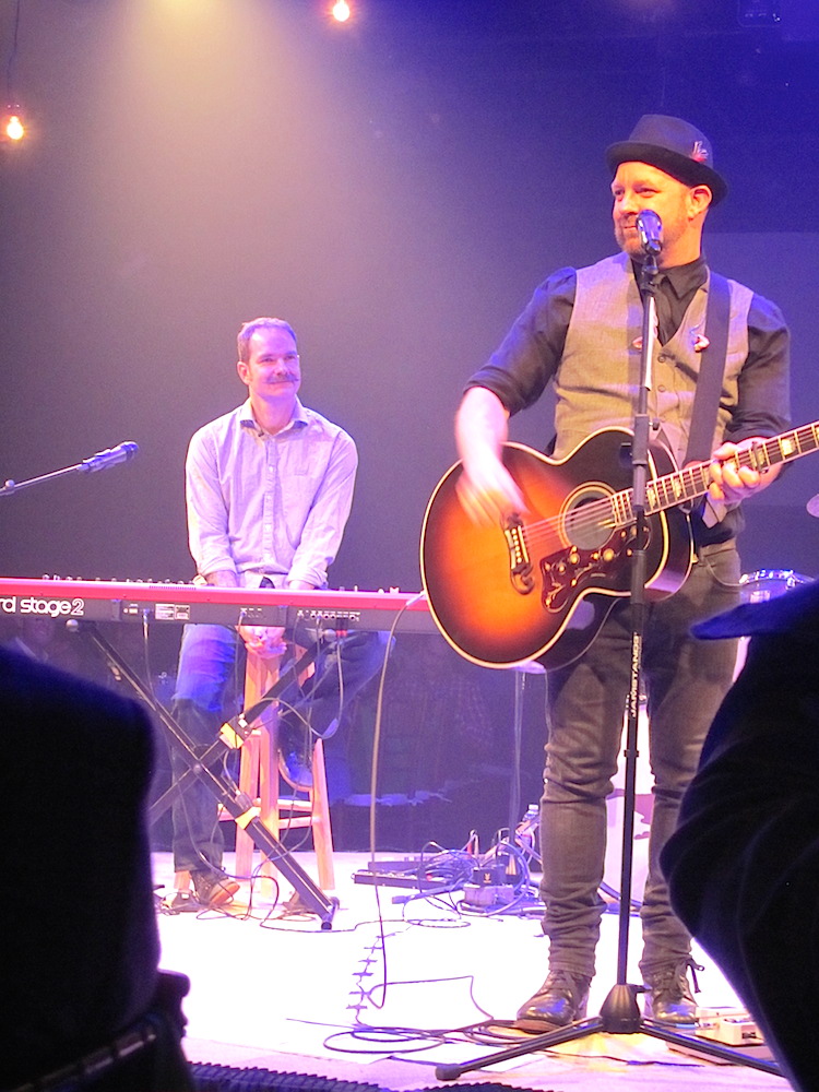 Kristian Bush, right, and his brother, Brandon, performing for charity at Scripps Networks International.