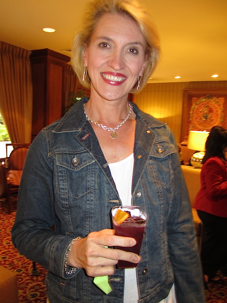 While waiting to board the buses, we enjoyed blackberry shinegrias -- sangria made with moonshine! Here's my date for the night, Mary Bogert. (Alan had to go out of town on biz, poor guy!) Mary, general manager of the Knoxville Convention Center, is a huge foodie.