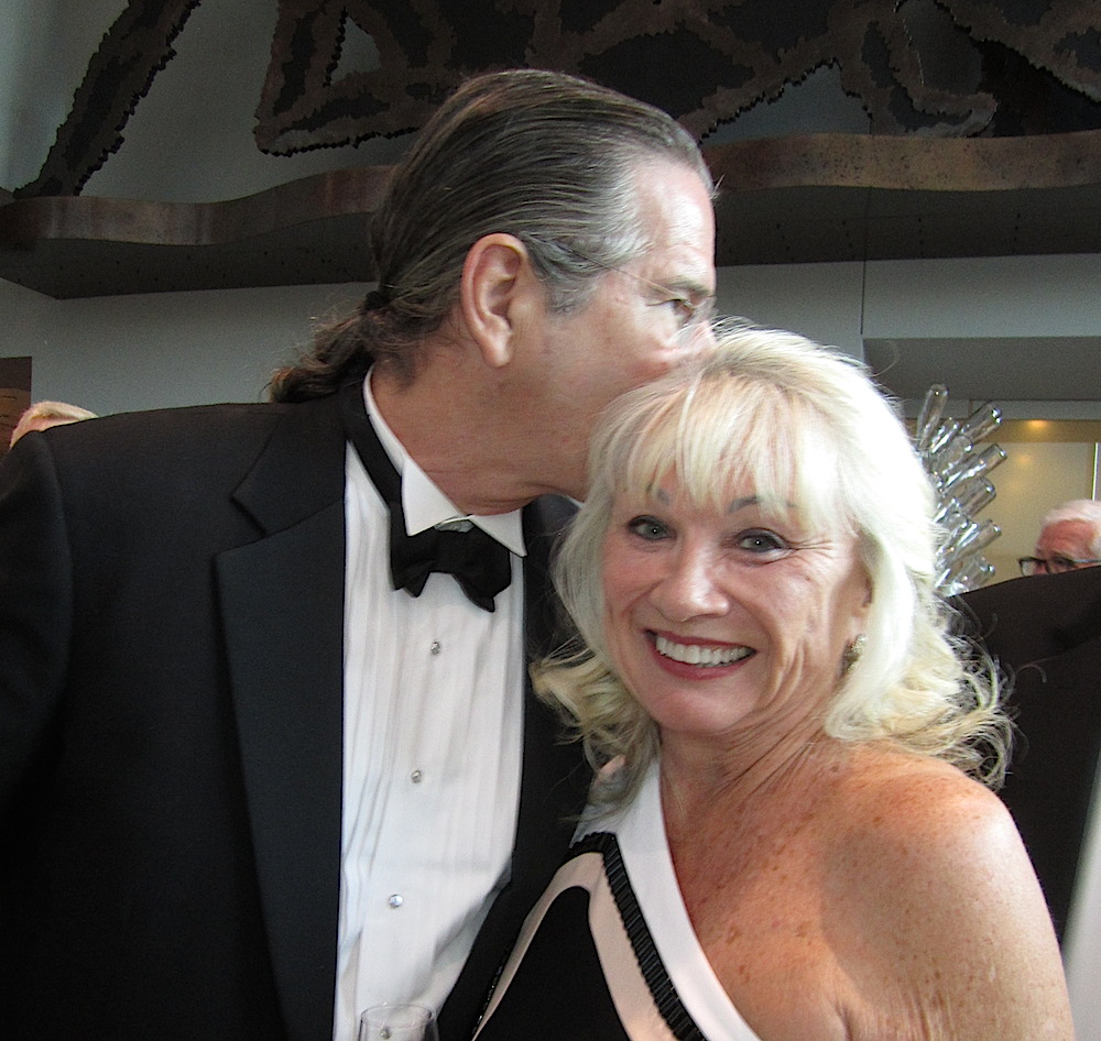 Richard Jolley gives a kiss on the head to Joan Allen.