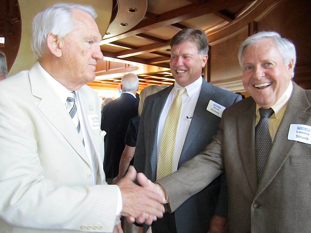 Charlie Severance, left, greets Mark Blakely and Lonnie Strunk.