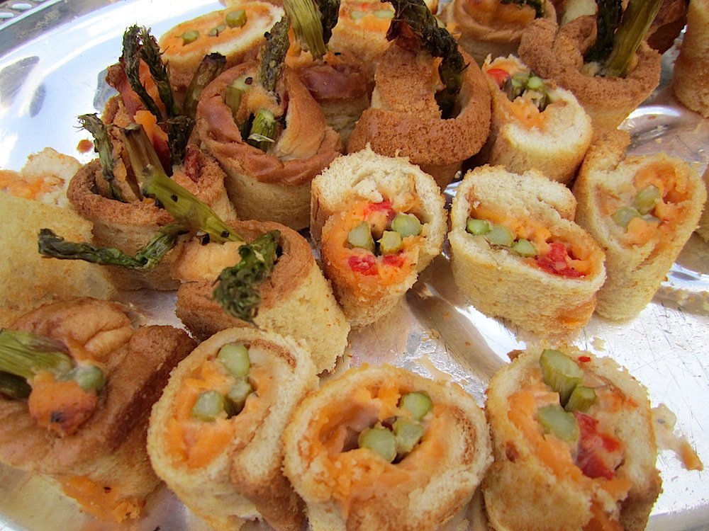 Caterer Holly Hambright is famous for her candied bacon. But these are my favorite appetizer she offers: asparagus and pimento cheese rolls.