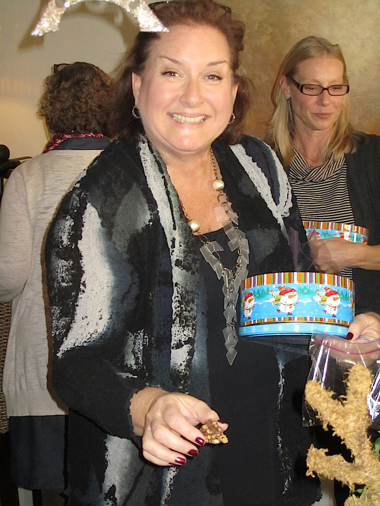 Mary Ellen Brewington loading up her tin at this year's cookie exchange.