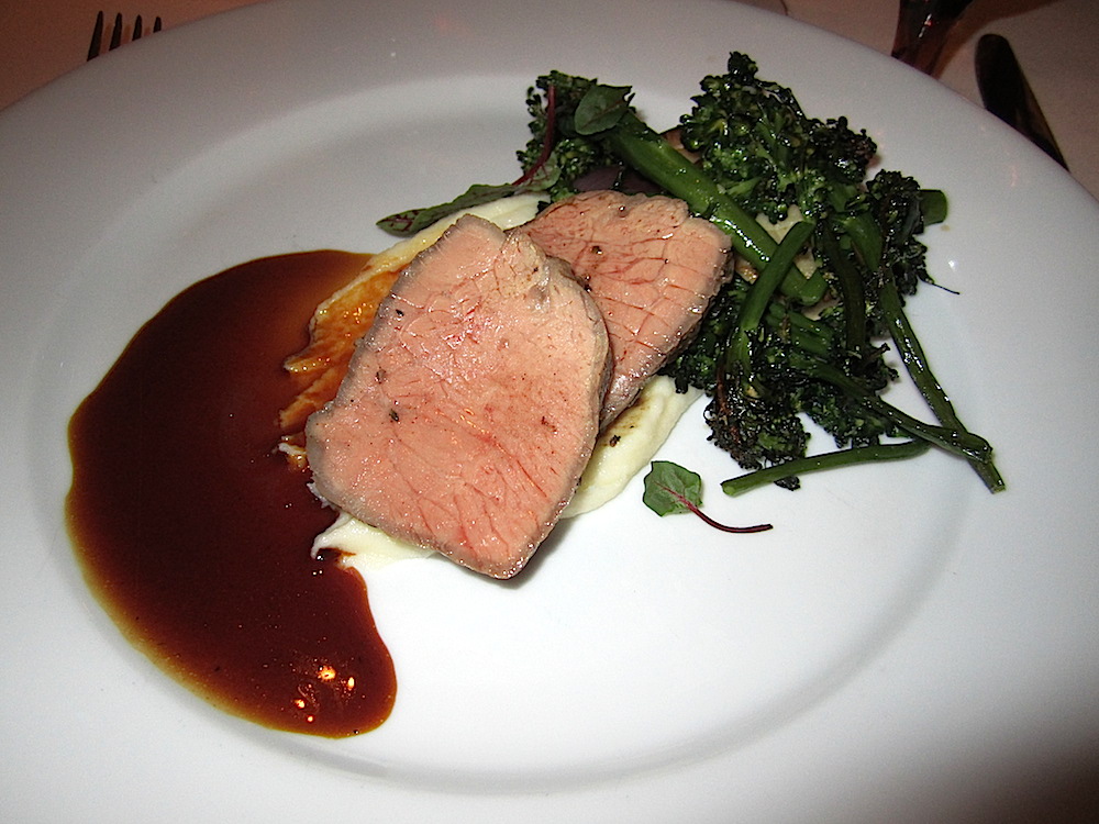 Creekstone beef strip loin was served with buttermild potato puree, roasted onions, broccolini and king trumpet mushrooms. Wine was a 2010 Mira cabernet sauvignon from Napa Valley.