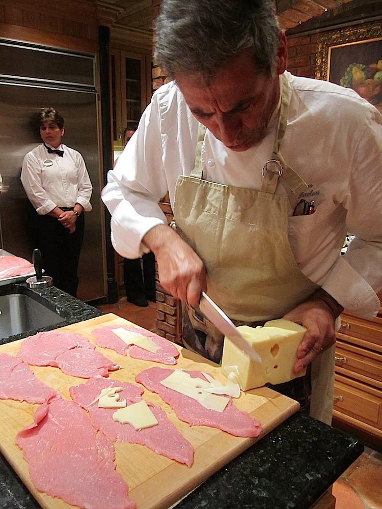Bette helped pound it thin and Chef Luciano sliced Swiss cheese onto each piece.