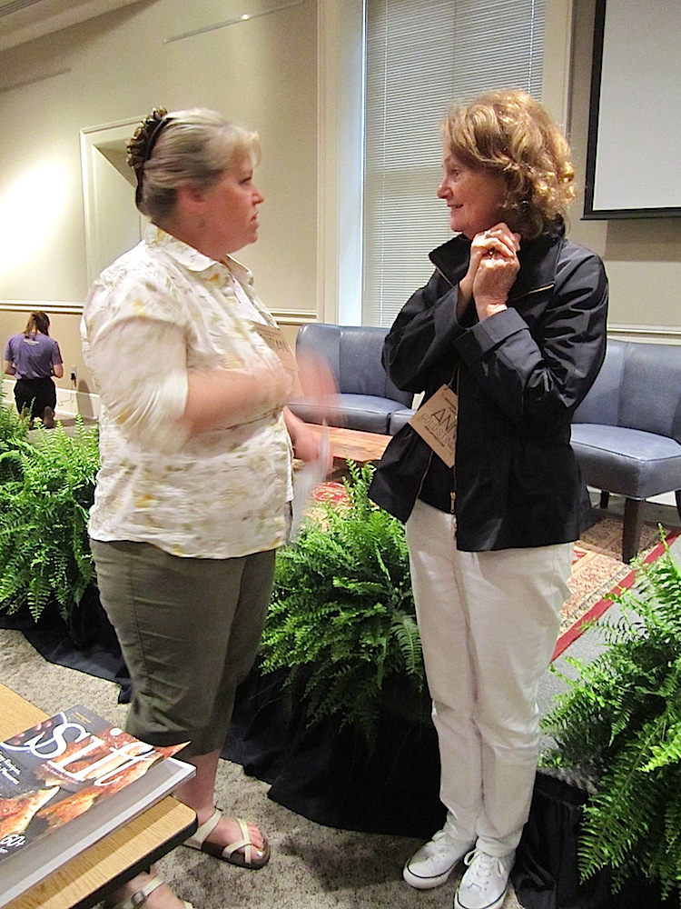 Susan Reid, left, chatting with attendee Ann Goldstine, is the editorial director of King Arthur Flour's new magazine, "Sift."