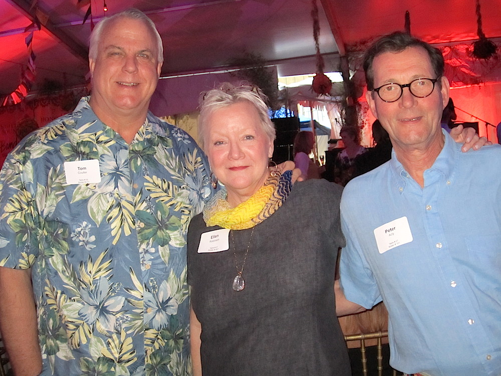 Tom Coulter, left, visits with Ellen Robinson and Peter Acly from our table.