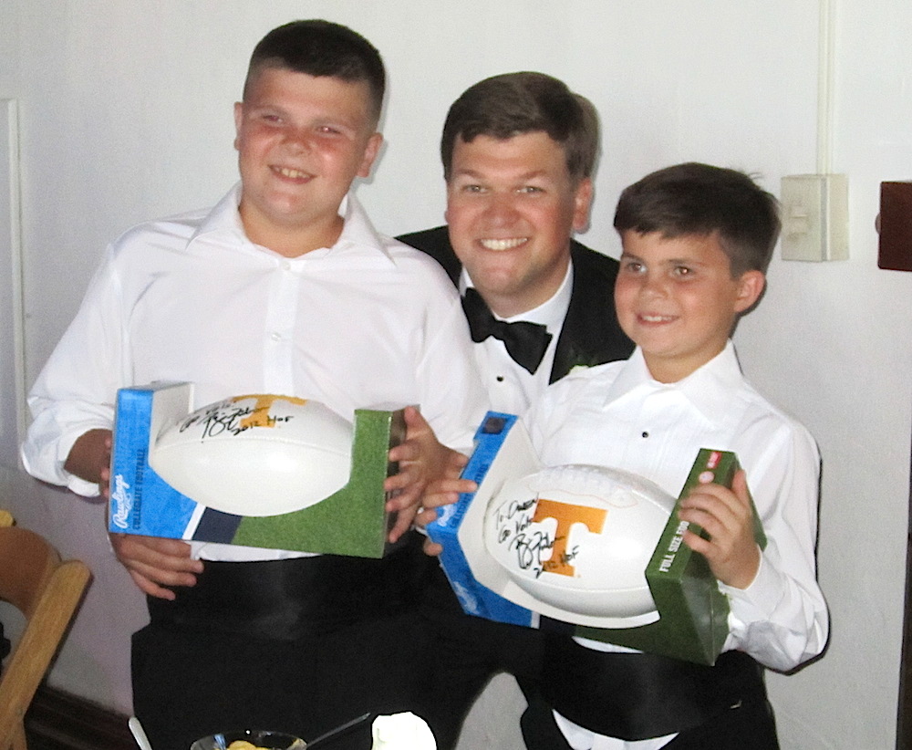 The groom with his cousin Bailey Black, left, the program attendant, and another cousin, Owen Black, the ringbearer.
